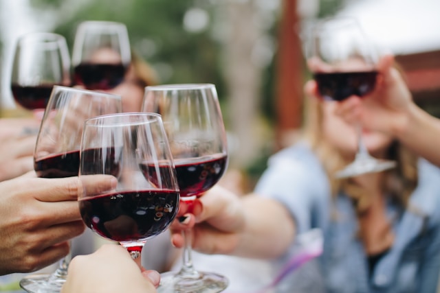 red wine glasses clinking