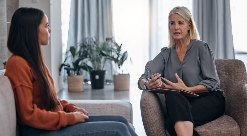 woman talking to therapist